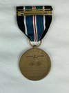 The back of the medal reads: To Supply Necessities of Life to the People of Berlin, Germany. (National Museum of the United States Air Force).