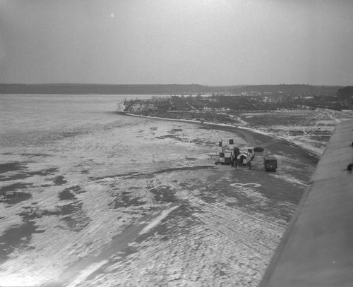 Elevated view of an airfield, covered in snow.