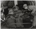Two men with sacks of coal in an aeroplane. Coal 2