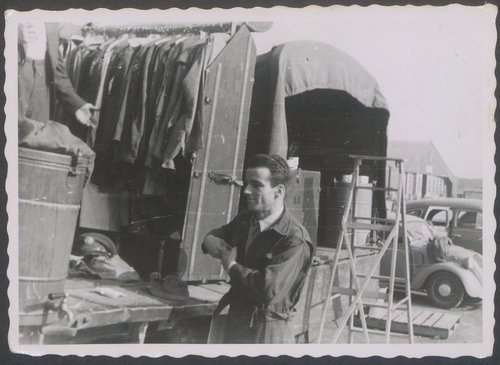 Leading actor Montgomery Clift standing in front of a makeshift dressing room during a break in shooting.