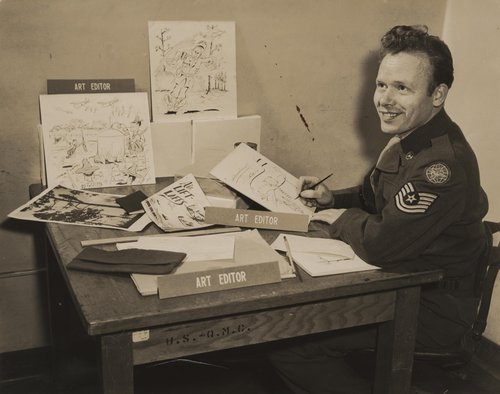 A man sitting at his desk.