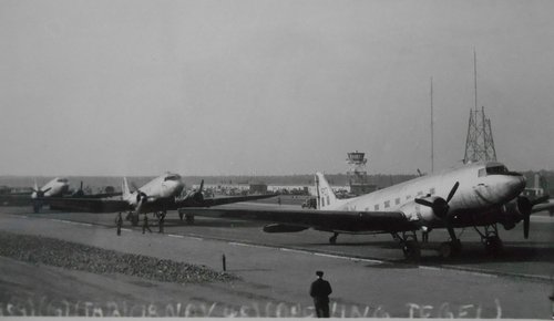 Three twin-engined transport aircraft on the ground.